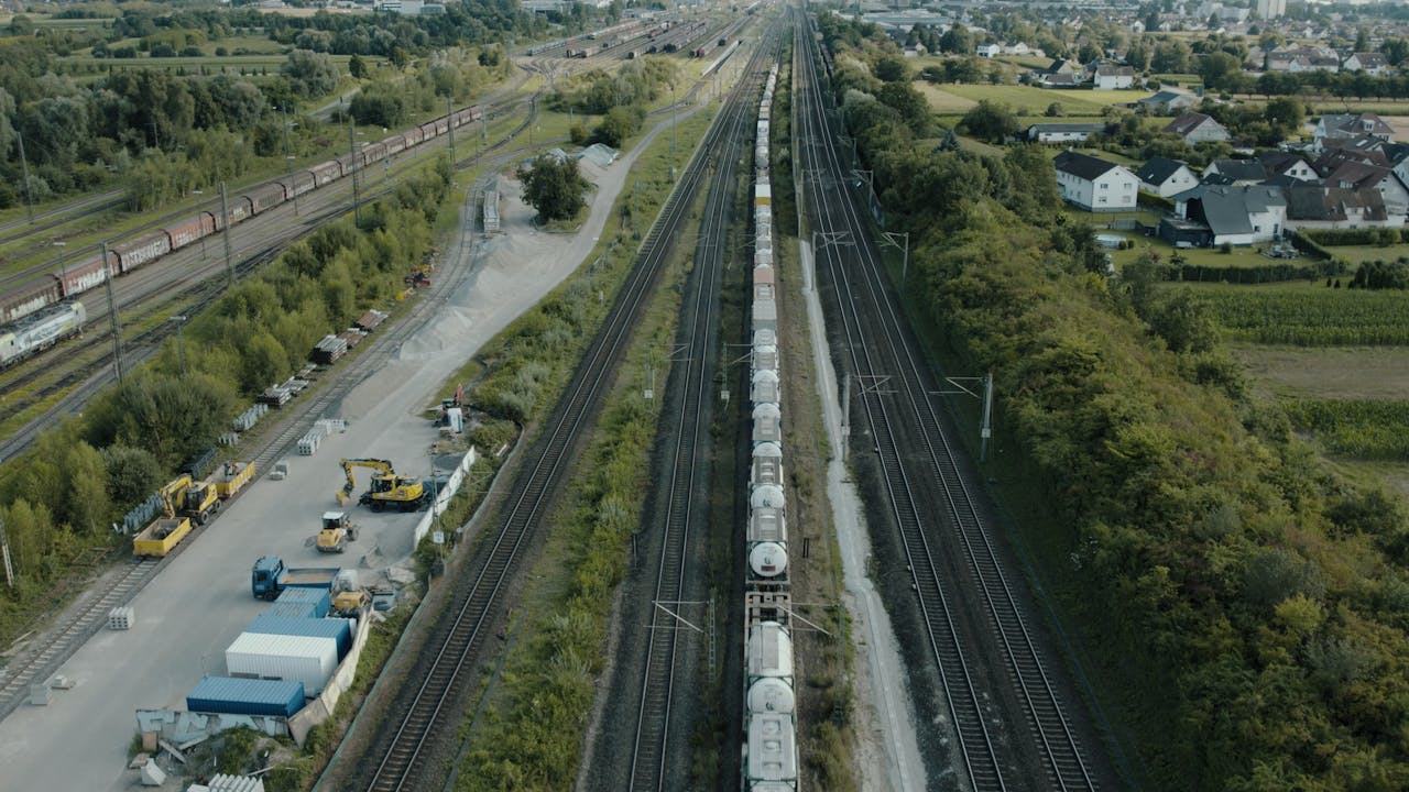 services-02 Aerial view of a freight train passing through railway tracks in Offenburg, Germany.